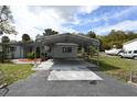 Home with carport, providing covered parking at 8827 W Millpoint Rd, Riverview, FL 33578