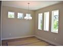 Bright dining room with hardwood floors and large windows at 1937 W Arch St, Tampa, FL 33607