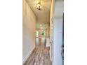 Bright and spacious entryway with tile flooring, leading to the living areas at 13203 Ogden Glade Rd, Dade City, FL 33525
