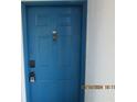 Building entrance with blue door and keypads at 2424 W Tampa Bay Blvd # L202, Tampa, FL 33607