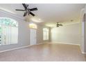 Bright living room with tile floors and ceiling fans at 2634 Brookville Dr, Valrico, FL 33596