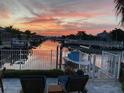 Serene canal views with private boat dock, lift, and paver patio at 406 Islebay Dr, Apollo Beach, FL 33572