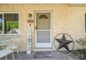 Front porch with patio set and star shaped decor at 27140 Thorncrest Ave, Brooksville, FL 34602