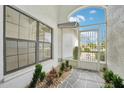 Front entry with a decorative gate and a stone path at 1830 E Del Webb Blvd, Sun City Center, FL 33573