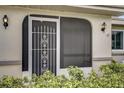 Front view of house featuring a screened entryway at 2329 Lancaster Dr, Sun City Center, FL 33573
