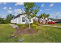 Landscaped yard with modern single story home at 16710 Shell Bay Dr, Land O Lakes, FL 34638