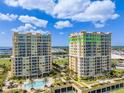 Condo building with balconies overlooking marina and water at 140 Riviera Dunes Way # 1403, Palmetto, FL 34221