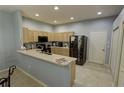 Kitchen with stainless steel appliances and island at 2822 Torrance Dr, Land O Lakes, FL 34638