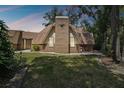 Unique dome-shaped home with brick facade and landscaping at 2512 Ayers Hill Ct, Lutz, FL 33559