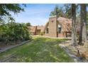 Brick home with unique architectural features and lush lawn at 2512 Ayers Hill Ct, Lutz, FL 33559