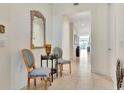 Bright and spacious condo hallway with seating area and mirror at 1022 Bellasol Way # 5302, Apollo Beach, FL 33572