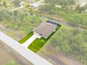 Aerial view showing home's location on a lot with canal access at 156 Haddock Dr, Rotonda West, FL 33947