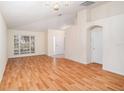 Bright living room featuring laminate floors and a ceiling fan at 11440 Misty Isle Ln, Riverview, FL 33579