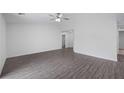 Spacious living room featuring light gray vinyl plank flooring at 12461 Patsy Ave, Port Charlotte, FL 33981