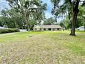 Large home on a spacious lot with mature trees at 1501 Buell Ct, Plant City, FL 33567