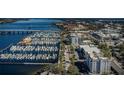 Wide aerial showcasing the waterfront, marina, and city at 1400 1St W Ave # 103, Bradenton, FL 34205