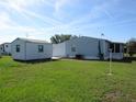 Manufactured home with shed and fenced backyard at 37241 Cora Ave, Zephyrhills, FL 33542