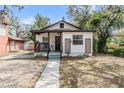 Charming home with a cozy front porch and well-maintained landscaping, offering a welcoming exterior view at 4304 W Laurel St, Tampa, FL 33607
