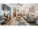 Bright living room with stylish furniture, hardwood floors, ceiling fan, and ample natural light at 4304 W Laurel St, Tampa, FL 33607