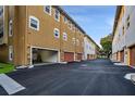 Row of garages with overhead doors in a residential complex at 111 N Albany Ave # 16, Tampa, FL 33606