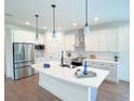Modern kitchen with stainless steel appliances and white cabinetry at 17399 Masten Ave, Port Charlotte, FL 33954