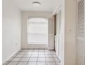 Small dining area with tile floor and built-in shelving at 14902 Par Club Cir # 14902, Tampa, FL 33618