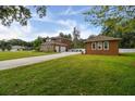 House with driveway, detached garage and large yard at 849 John Cressler Dr, Seffner, FL 33584