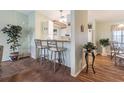 Kitchen with breakfast bar and view into dining area at 37607 Neukom Ave, Zephyrhills, FL 33541