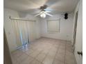 Empty bedroom with tile floors and sliding glass doors at 22491 Delhi Ave, Port Charlotte, FL 33952