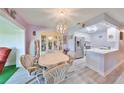 Charming dining room with a light wood table and hutch at 218 Glenellen Pl, Sun City Center, FL 33573