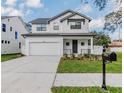 Two-story modern farmhouse style home with dark metal roof at 7203 S De Soto St, Tampa, FL 33616