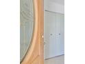 Light wood door with glass accents opens to a tiled entryway at 1607 Cloister Dr, Sun City Center, FL 33573