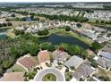 Property overview showing location near a lake and other homes at 804 Regal Manor Way, Sun City Center, FL 33573