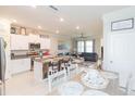 Open-concept kitchen with granite countertops and island seating at 8065 Rolling Shell Trl, Wesley Chapel, FL 33545