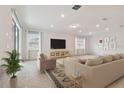 Bright living room with tile floors and neutral decor at 2766 Dolores Home Ave, Valrico, FL 33594