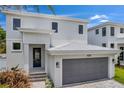 Modern two-story house with gray garage door at 2345 Bahia Vista St, Sarasota, FL 34239