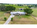 Aerial view of a ranch home on a spacious lot with farm views at 31226 Saint Joe Rd, Dade City, FL 33525