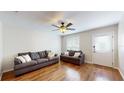 Bright living room with hardwood floors, ceiling fan, and comfy sofas at 11310 Stratton Park Dr # 1, Temple Terrace, FL 33617