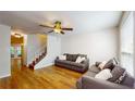 Living room with hardwood floors and staircase at 11310 Stratton Park Dr # 1, Temple Terrace, FL 33617