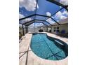 Relaxing pool and spa with a covered patio and seating area at 812 Tidal Rock Ave, Ruskin, FL 33570