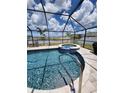 Screened-in pool and spa with a spacious patio area at 812 Tidal Rock Ave, Ruskin, FL 33570