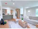 Open concept living room and kitchen with light and airy feel at 17476 Quentin Ave, Port Charlotte, FL 33954