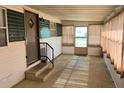Bright enclosed Florida room with screen door at 39047 Ola Ave, Zephyrhills, FL 33542