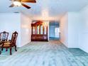 Bright dining room with wood hutch and chandelier at 1810 Haverford Ave, Sun City Center, FL 33573