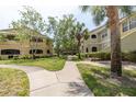 Two-story building with lush landscaping and walkways at 1228 S. Missouri Ave # 607, Clearwater, FL 33756