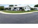 Ranch-style home with a well-manicured lawn at 10032 36Th N St, Pinellas Park, FL 33782
