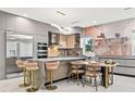 Modern kitchen with island, stainless steel appliances, and stylish decor at 6018 Kipps Colony E Dr, Gulfport, FL 33707