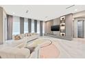 Spacious living area with contemporary furniture and large windows at 6018 Kipps Colony E Dr, Gulfport, FL 33707
