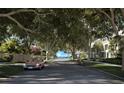 Residential street lined with lush trees and upscale homes at 3015 S Ysabella Ave # 1404, Tampa, FL 33629