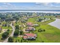 Luxury waterfront home with expansive green lawn at 12310 Stonelake Ranch Blvd, Thonotosassa, FL 33592